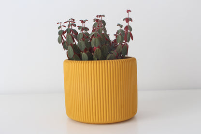 Colorful handmade ribbed planter